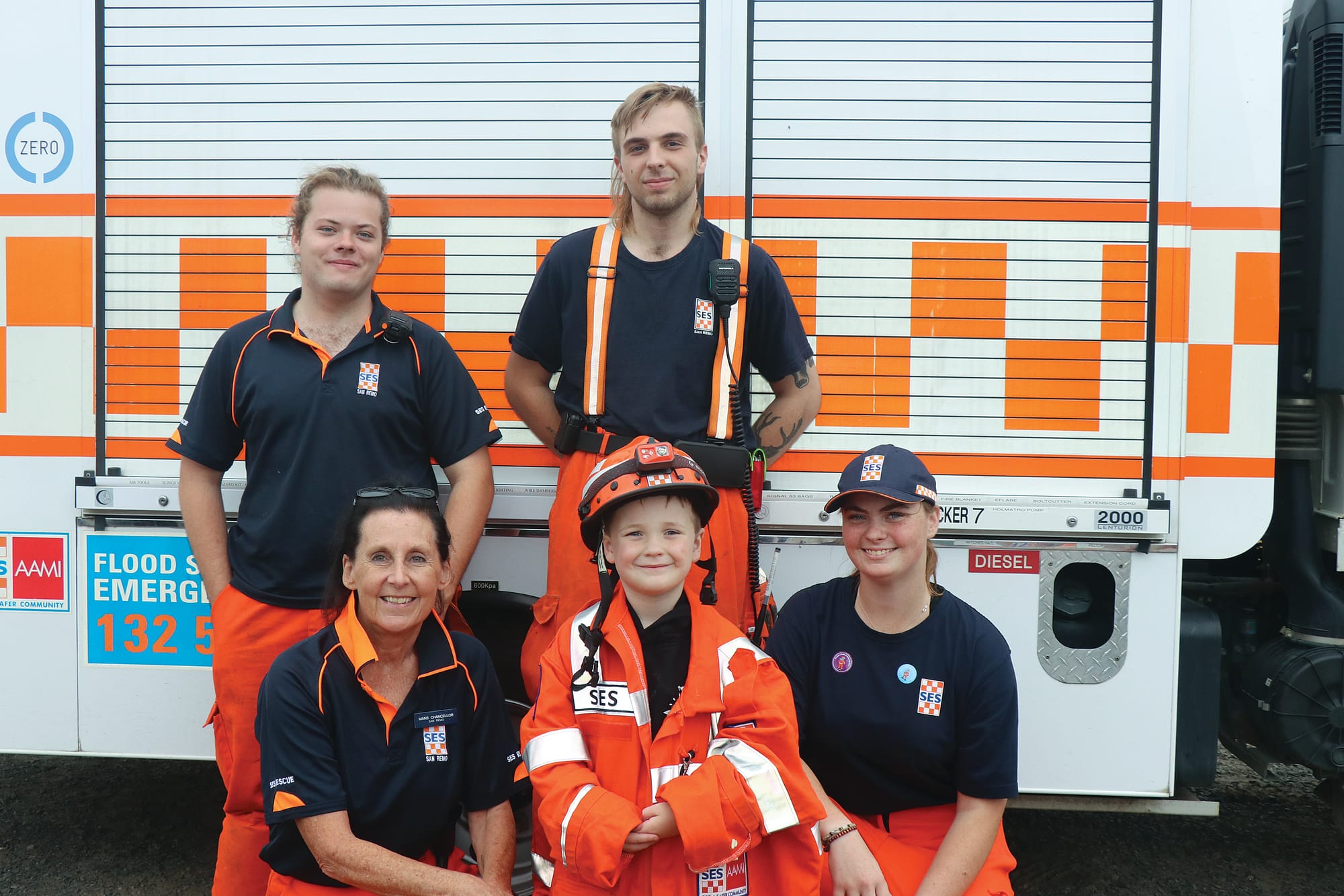 Young Jaxton Passarin dressed up as an SES volunteer with unit controller Mandy Chancellor and the San Remo SES volunteers at the Kilcunda Lobster 
Festival. Z37_0523