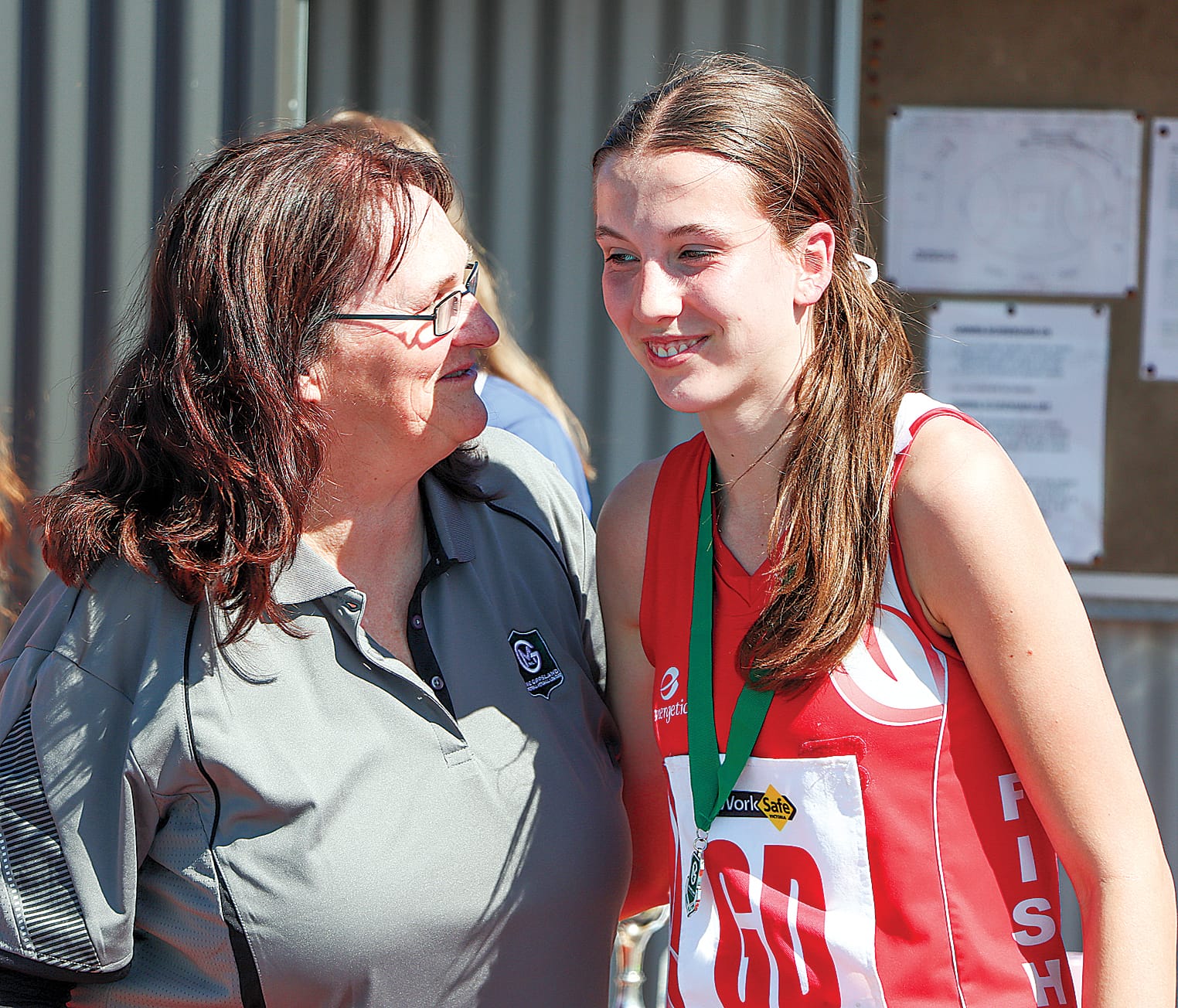 Ella Cocksedge is congratulated on being Fish Creek’s best player in its upset win in the 17 and under Grand Final against MDU. A11_3823