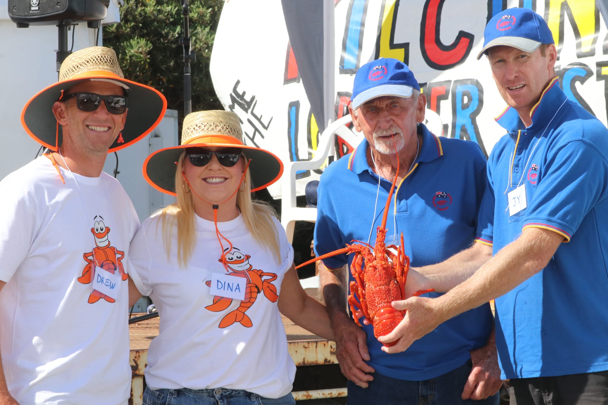 Volunteers Drew, Dina, Frosty and Jy giving away the San Remo Co Op lobsters as part of the spinning wheel prize. 