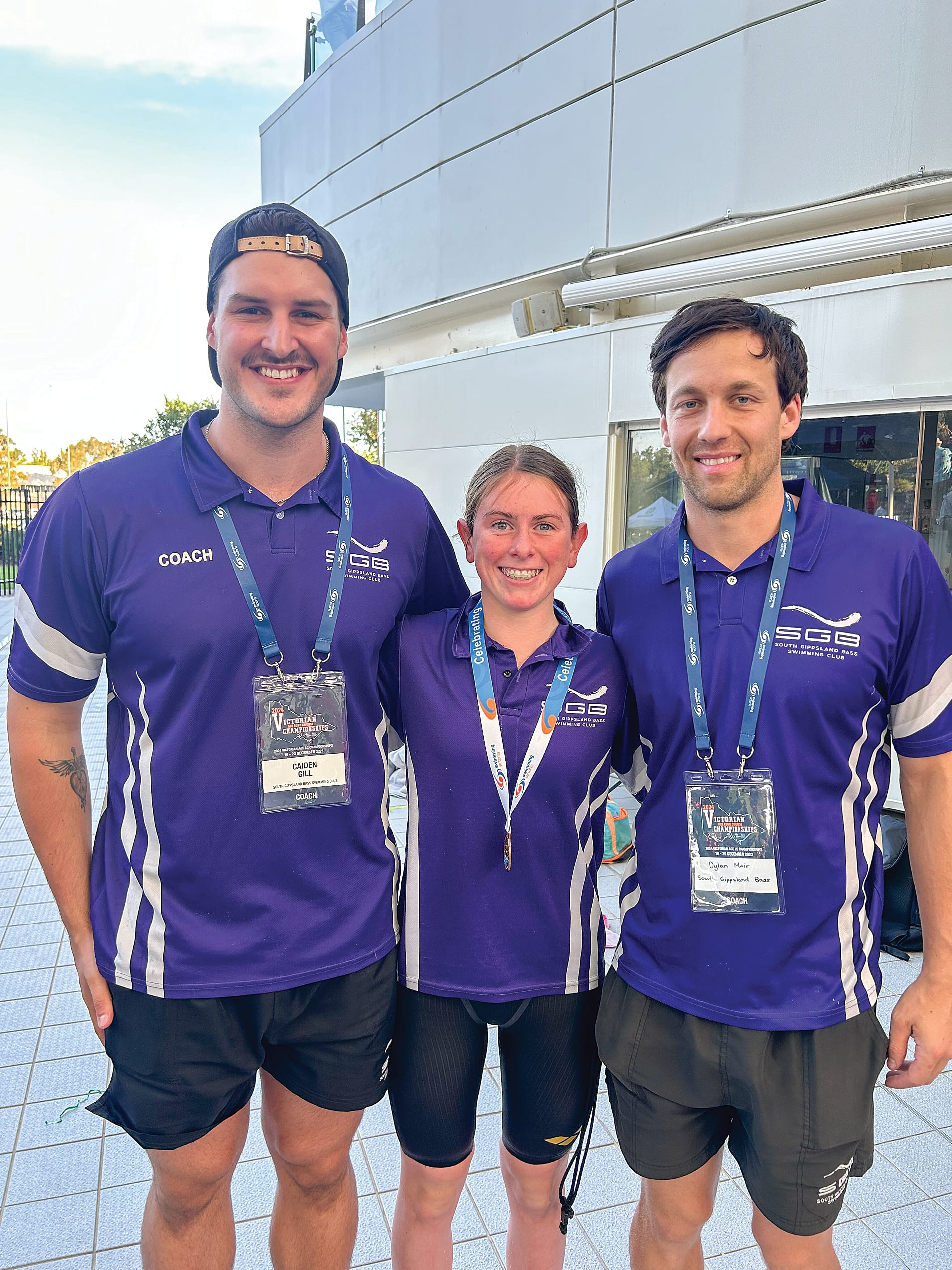 Claudia with South Gippsland Bass Swimming Club coaches Caiden and Dylan.