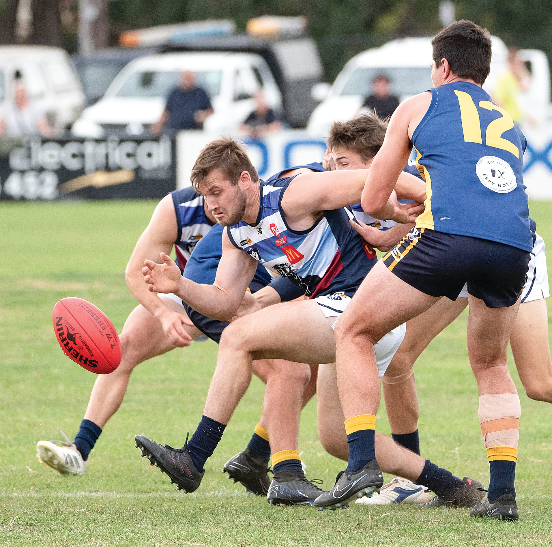 Bradley Aldwell works through a pack of Sea Eagles to get to the footy. Photos: Anna Carson