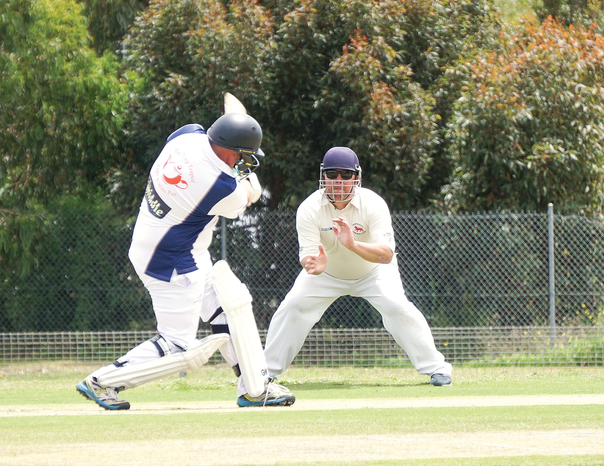Trevor swings big as his Imperial opponent anticipates the ball. Ns04_0424