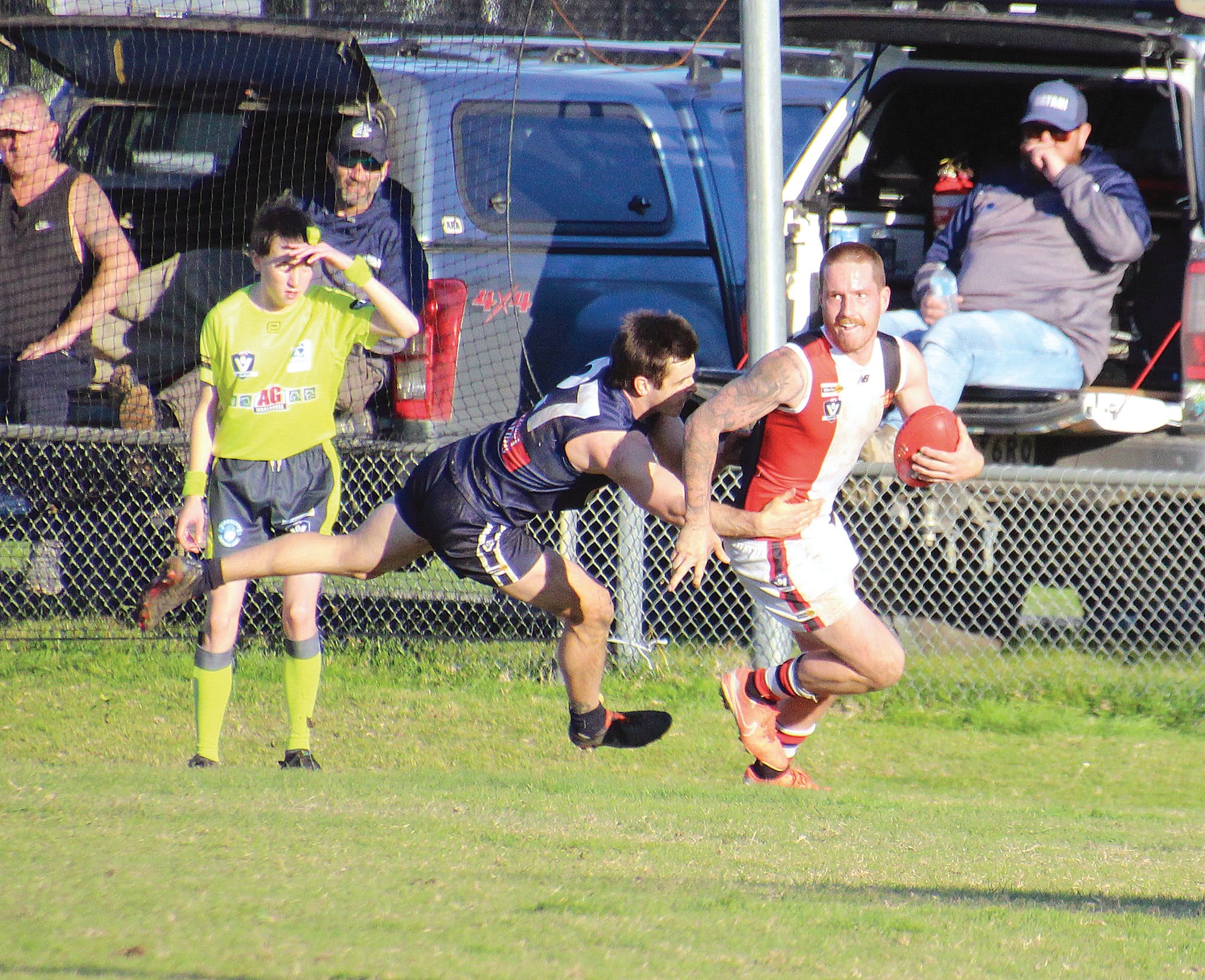 Lewis Kennedy managed to shrug this tackle.