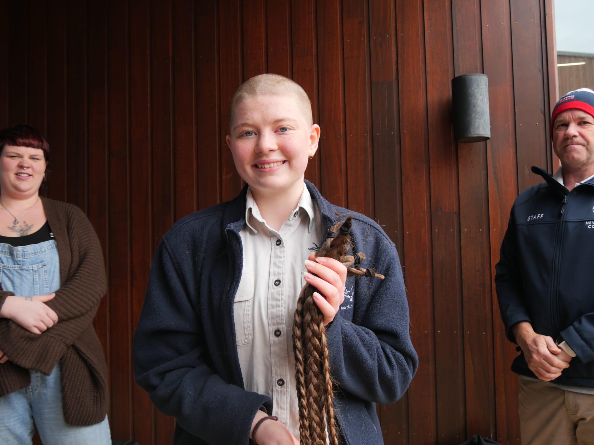 Newhaven College Year 9 student Georgia Sanders shows off her ‘Brave Shave’ – raising funds for the Australian Cancer Research Foundation. She is also donating her braids to ‘Wigs4Kids’.