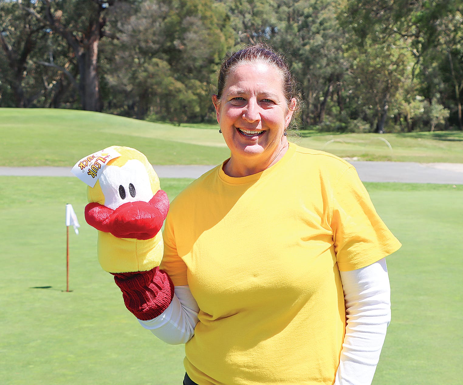 Leongatha Golf Club General Manager Kate Rowe shows off Leuk the Duck, Challenge’s driver cover. A16_4425