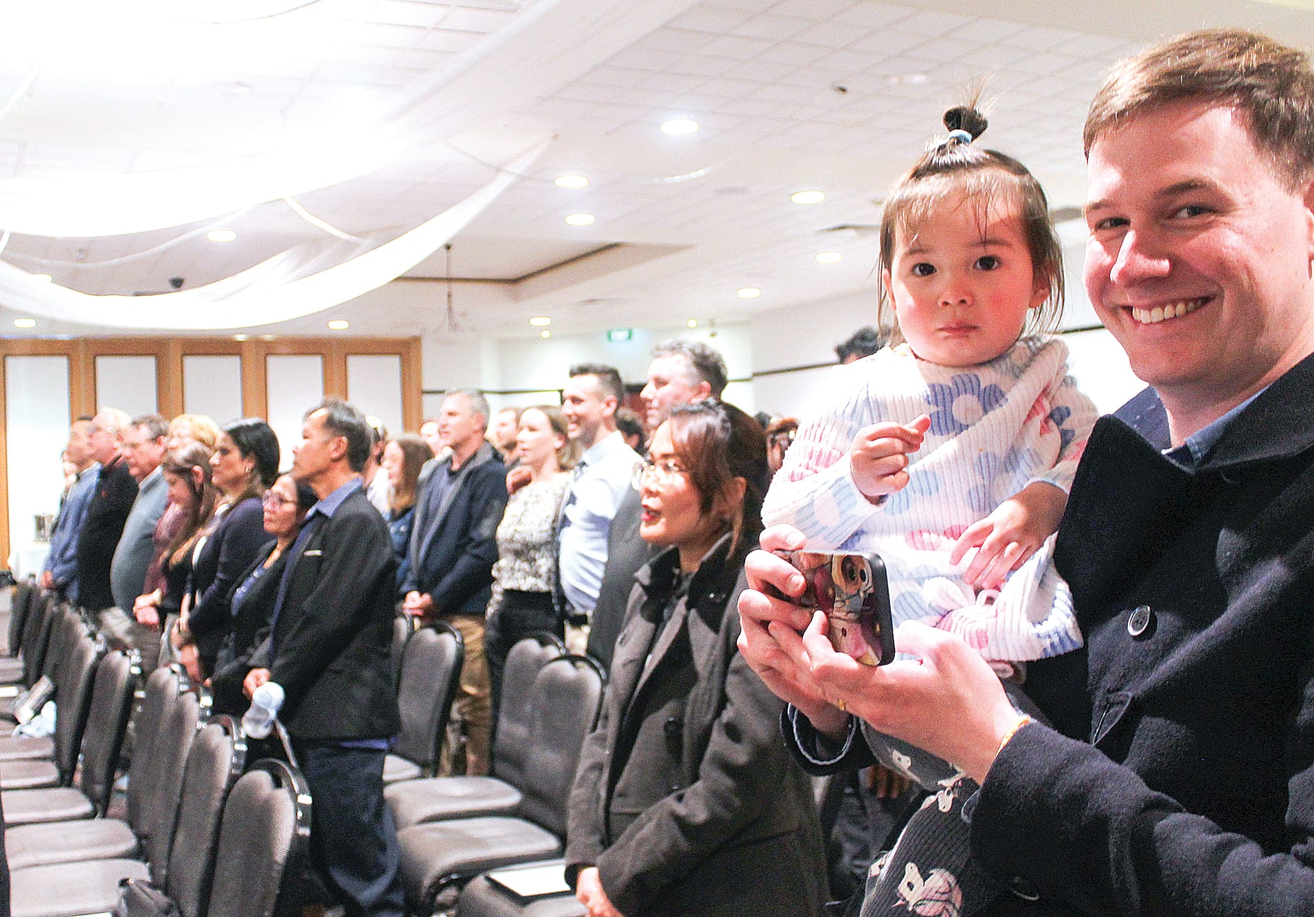 Brendan and his daughter Maryanne sharing a personal moment during last week’s Citizenship Ceremony at the Wonthaggi Workmen’s Club. B78_4325
