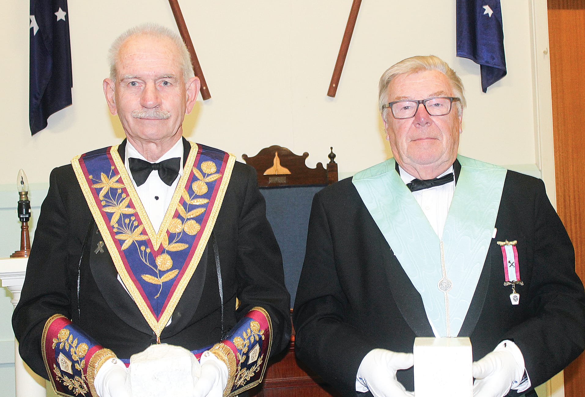 Freemason Ken Barnes holds a rough ashlar, the symbolic representation of a man’s unrefined, imperfect state at the beginning of his spiritual and moral journey through life, and Freemason Michael Saunders holds a perfect ashlar symbolising a Freemason who has worked to achieve a purposeful, principled and righteous life. B08_4125
