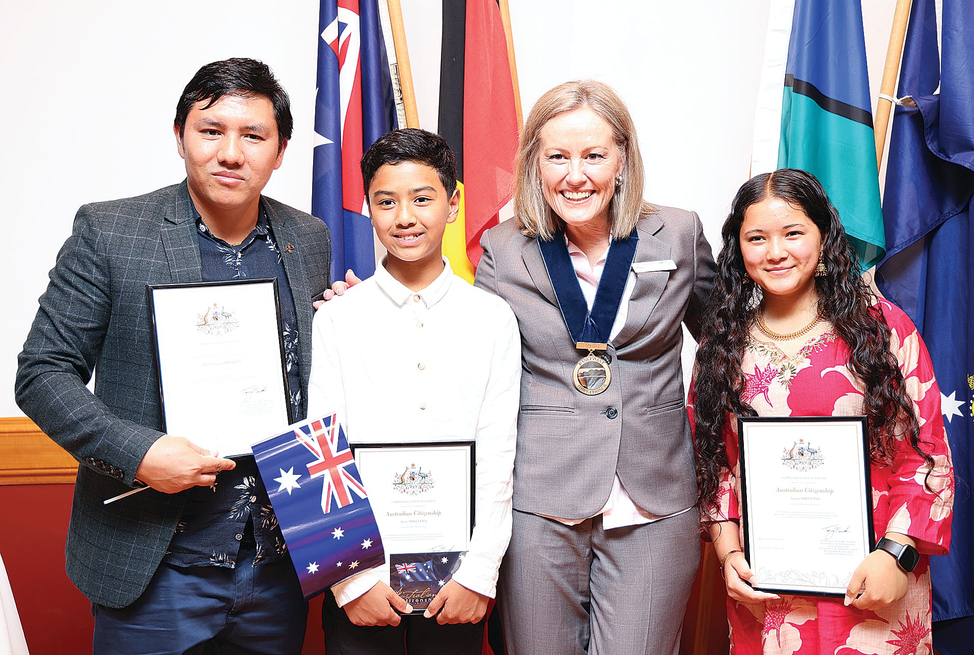New Australian citizens Ram, Arun and Aruna Shrestha with Bass Coast Mayor Cr Rochelle Halstead. B80_4325