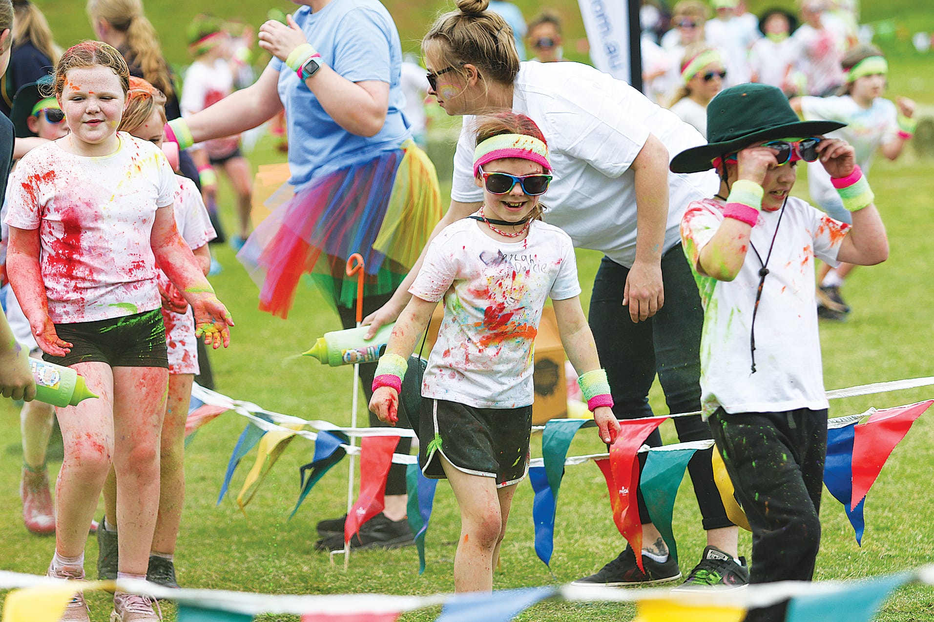 Students are happy to be doused in colour, with staff ready to oblige.
