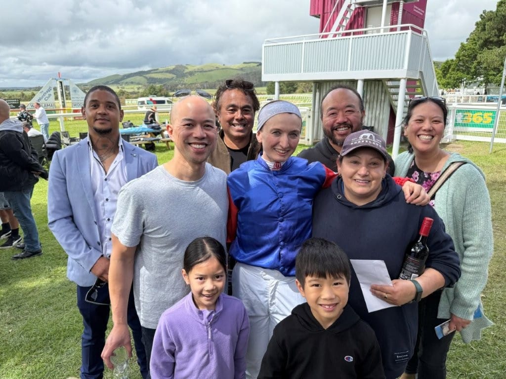 The Chen family, who sponsored Race 3 in memory of their late mother Marina, get together with winning jockey Jasmine Trenwith and one of the owners Bernie Gafa after the presentations.