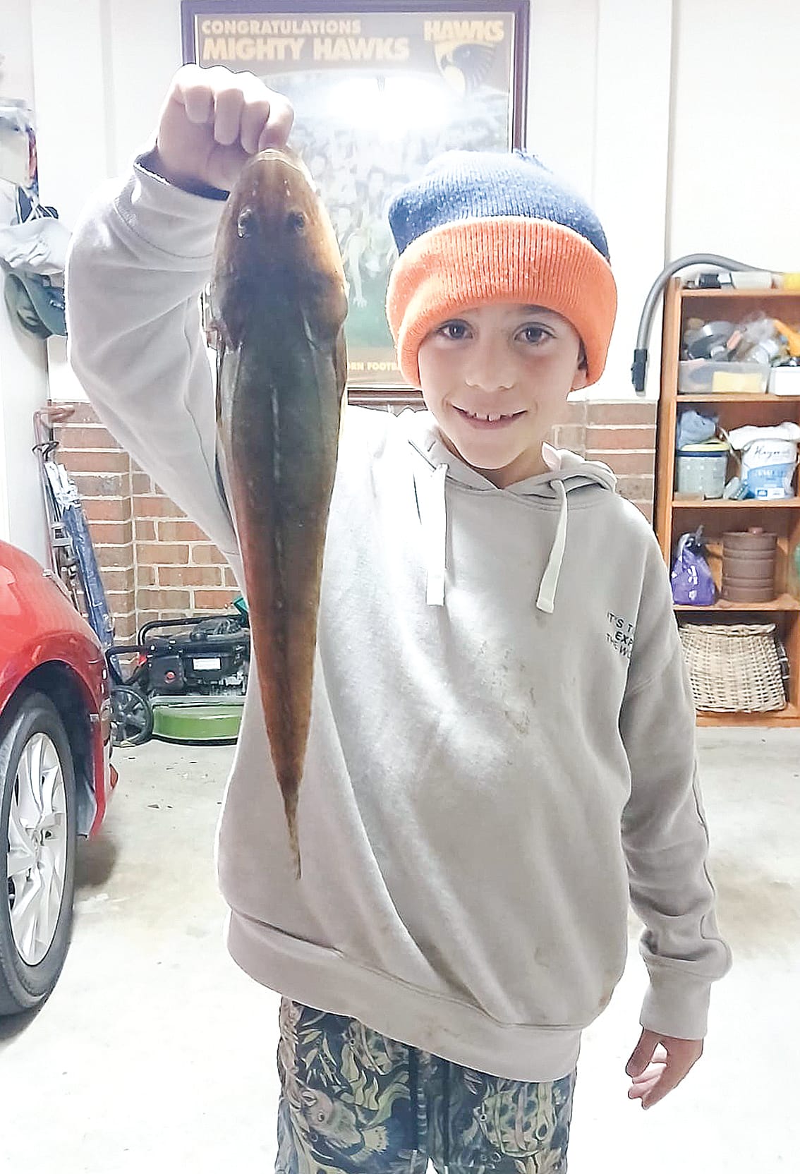 Young angler shows how its done with a prize catch