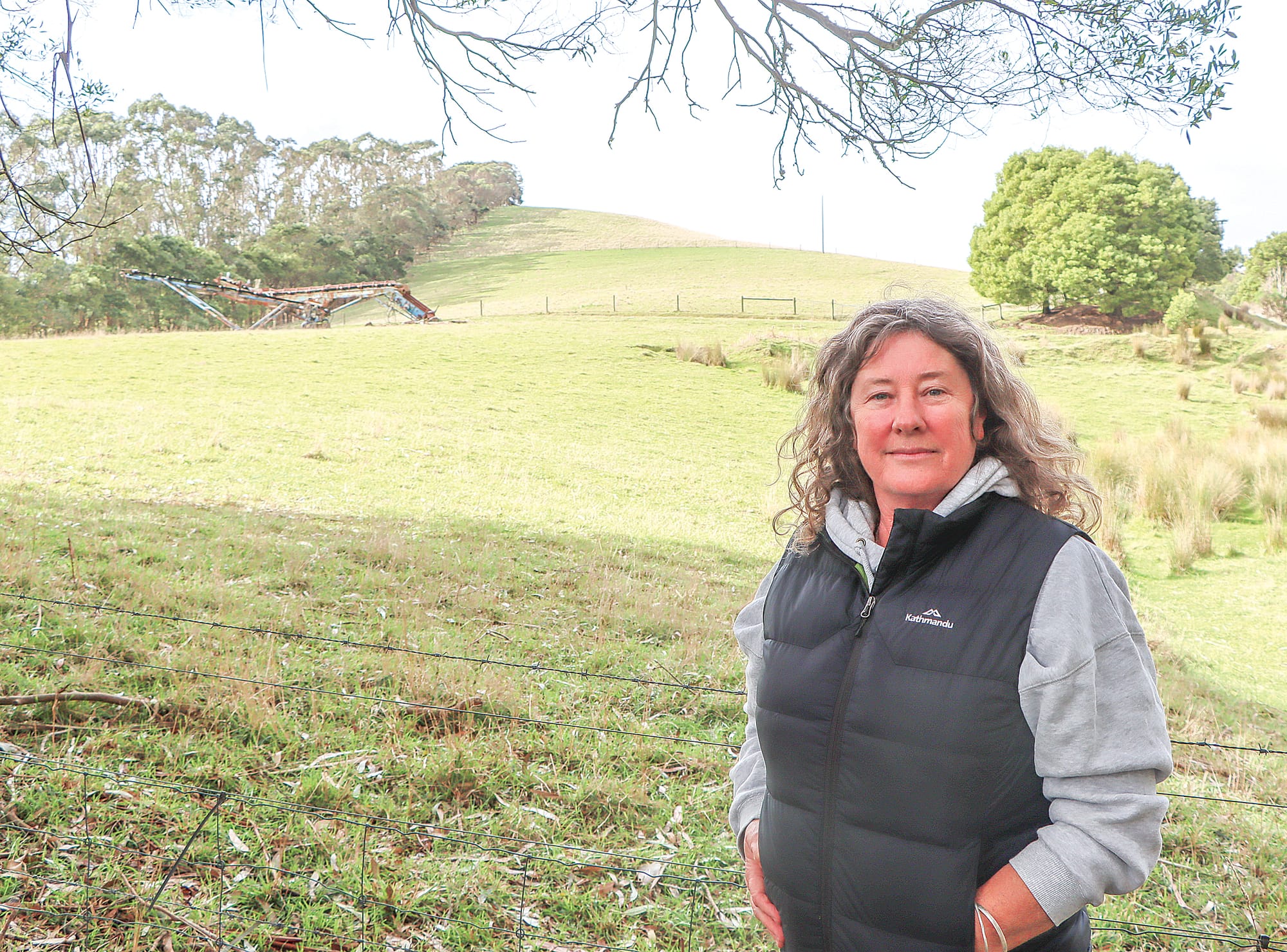 Kim Kemper says the Work Authority area for the intended new quarry extends to halfway between where she is standing at her boundary fence and the piece of disused machinery behind her.
