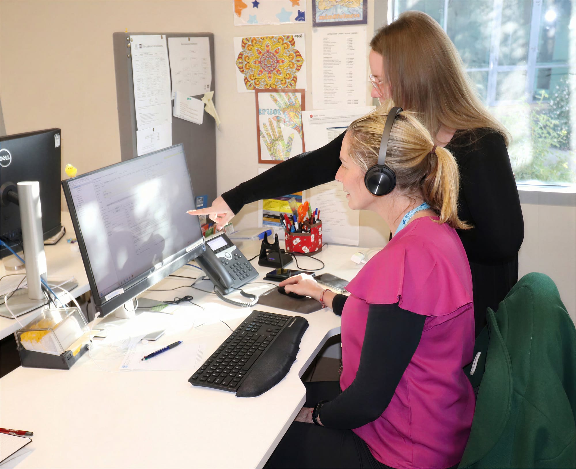 Alcohol and other drugs team members at Leongatha Memorial and Korumburra hospitals, Aimee Morrison, seated, and Laura Nicholas, discuss care approaches.