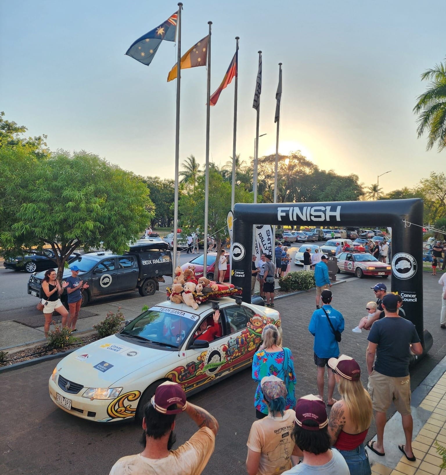Rod and Lyndell Cope’s Santa-inspired Commodore reaches the finish line in Darwin.