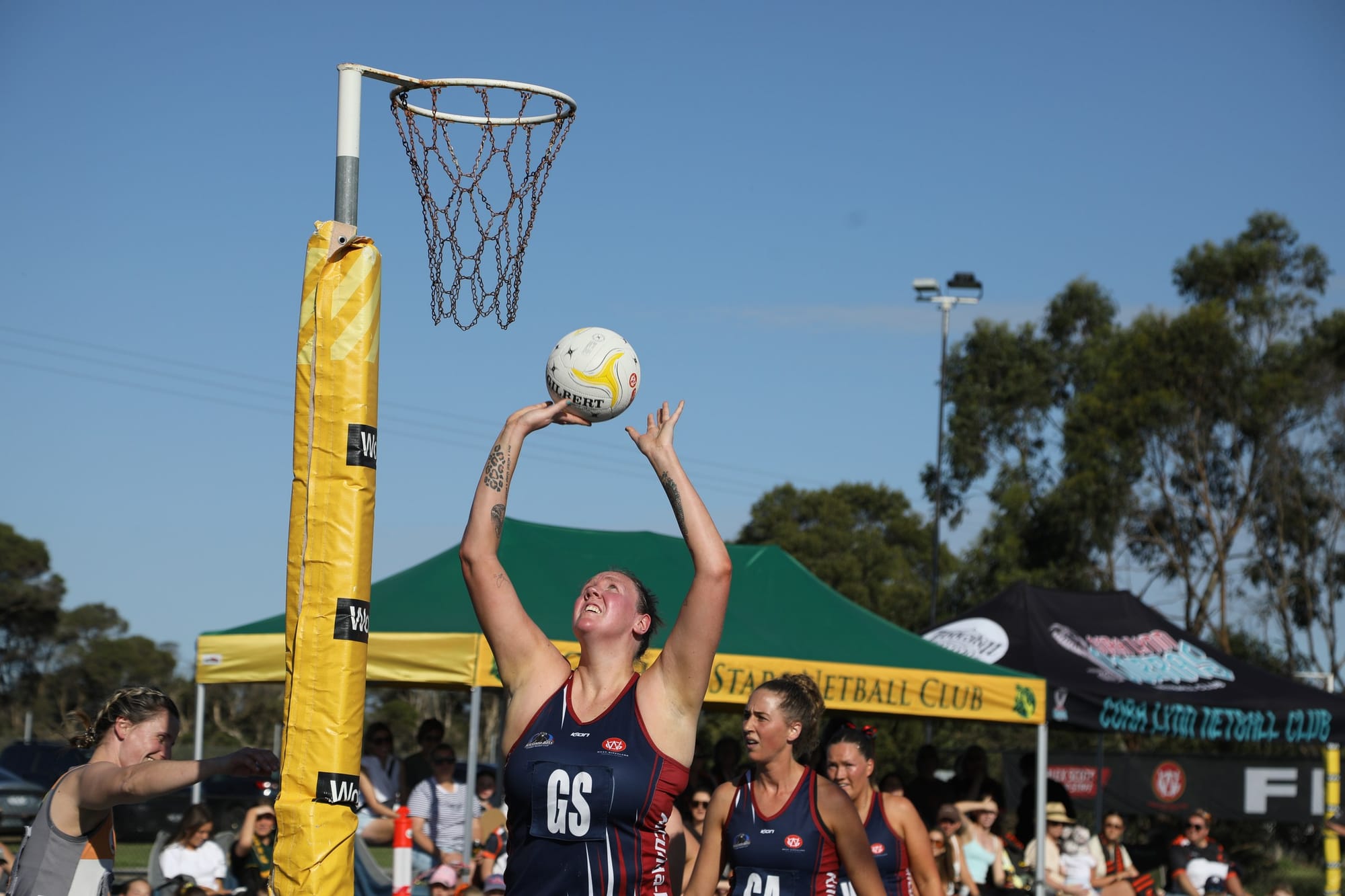 Emma Ryde marks above her head in the goal circle