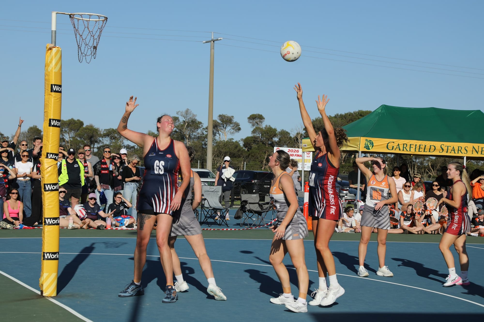 Erin Bell shoots for goal with Emma Ryde nearby