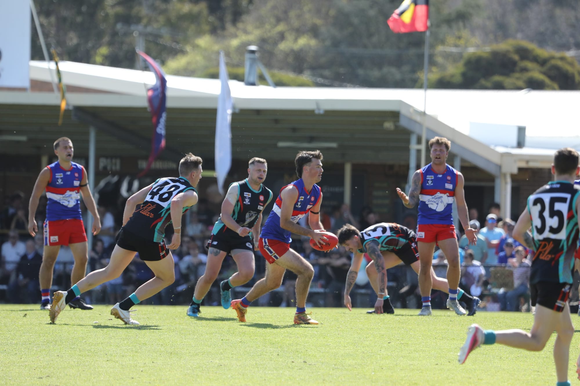 Max Taylor runs with the ball for Phillip Island
