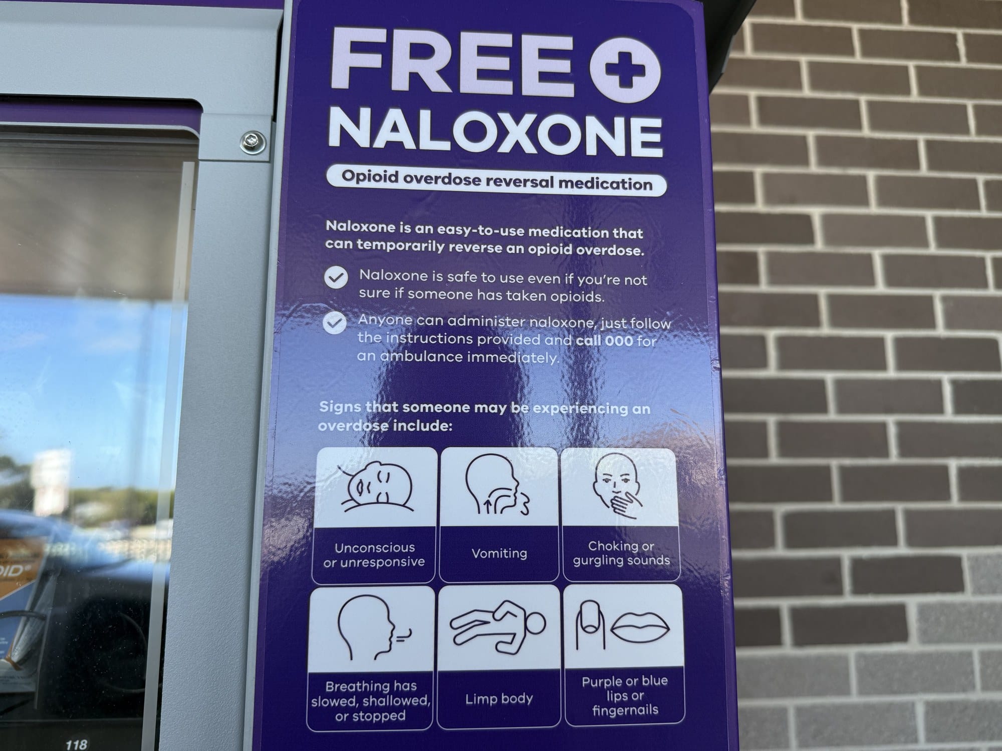 The signage on the naloxone vending machine listing the signs of an overdose