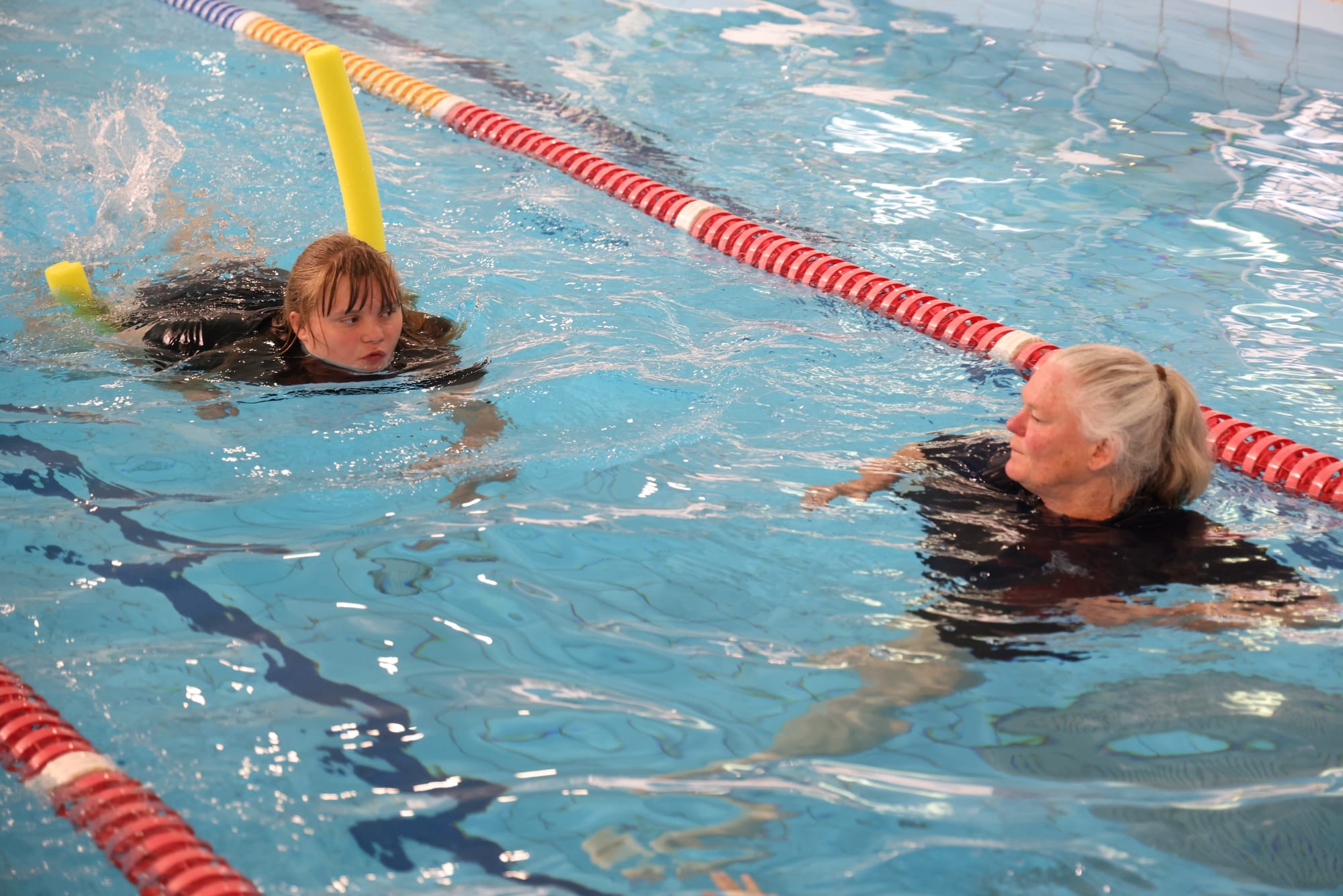 Bass Coast Specialist School swim instructor Rachel Cullen with student Quinn during the swimming sports carnival.