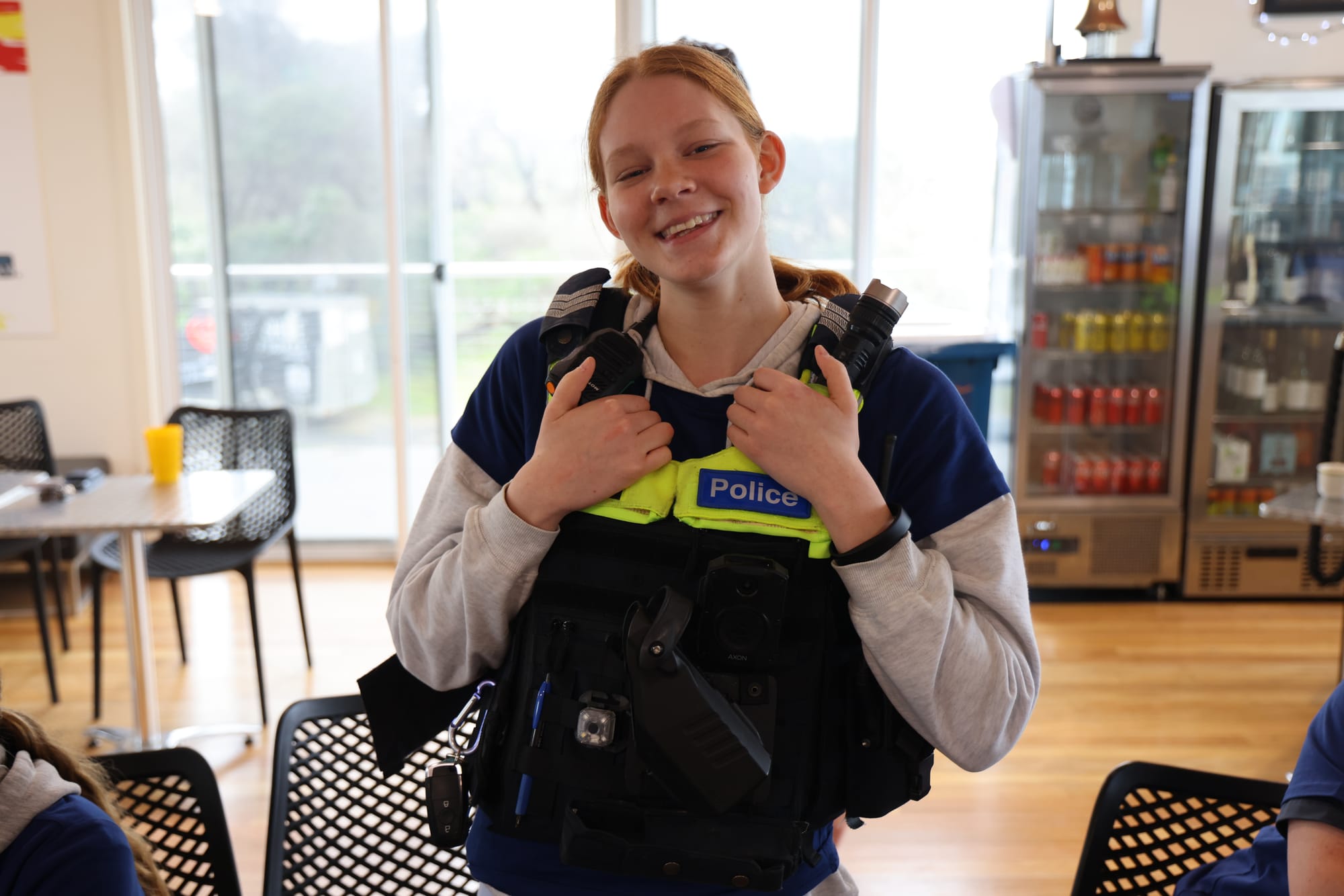 Mia Sutherland got the chance to try on a police vest during Wonthaggi Police’s visit to the surf club.