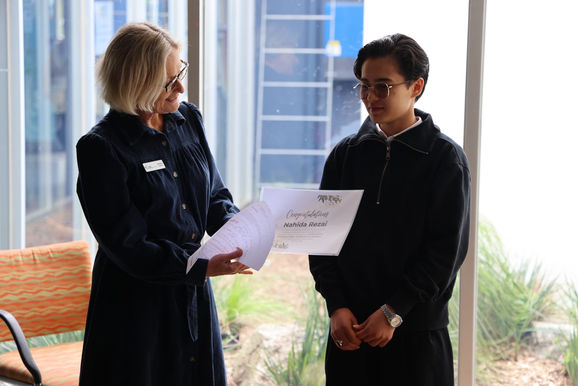 Westvic workforce development manager Katherine Cousins presents Nahida Rezai with a certificate recognising her achievements.