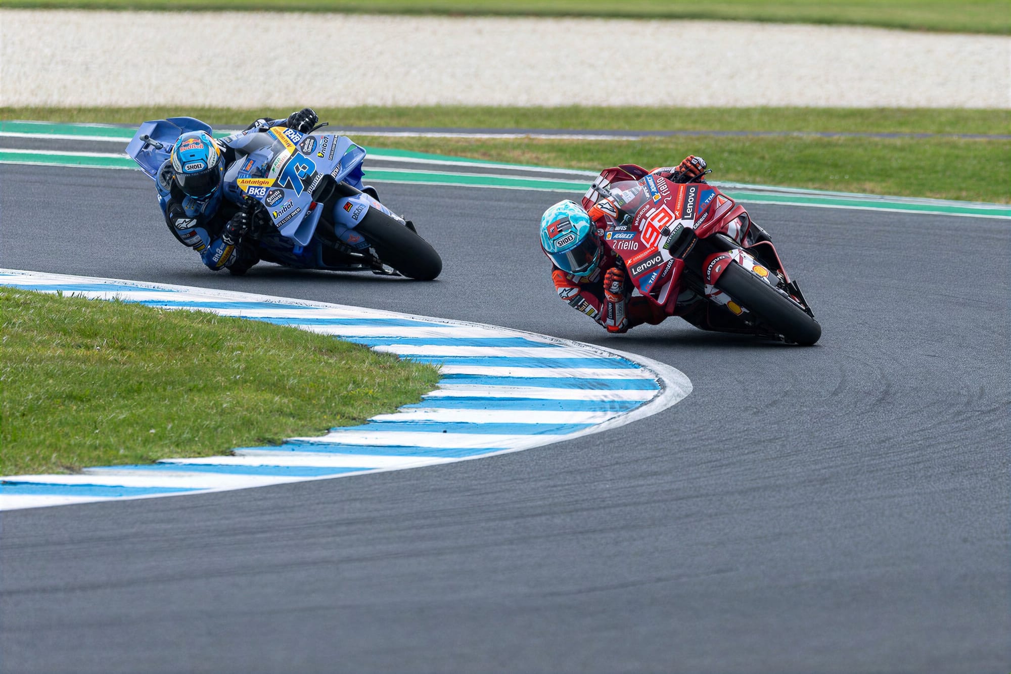 The Marquez brothers put on a Ducati one-two show as Marc leads Alex through turn four on the final lap.