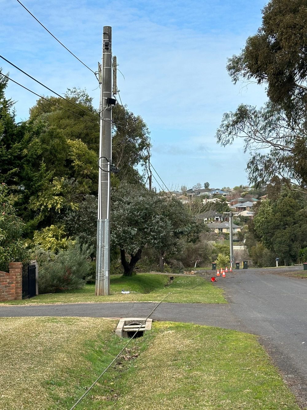 Power lines lying on residential street for over 24 hours post image