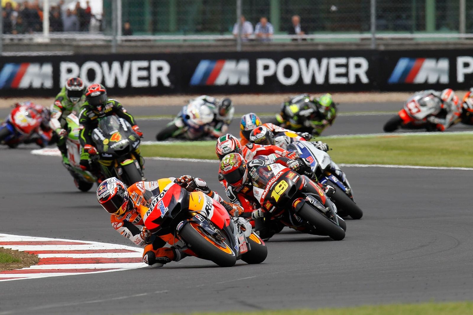 Casey Stoner leads the pack on his Repsol Honda