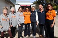 Community celebrates first year of Orange Sky laundry service post image