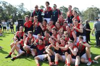 The MDU reserves premiership side celebrate with the cup