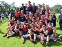 The MDU reserves premiership side celebrate with the cup