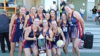 The Kilcunda Bass A Grade netball side with the premiership cup