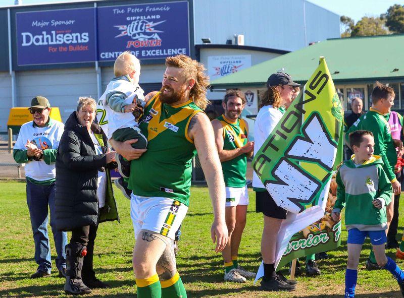 Leongatha's Benny Willis kicks a bag in 200th game celebration post image