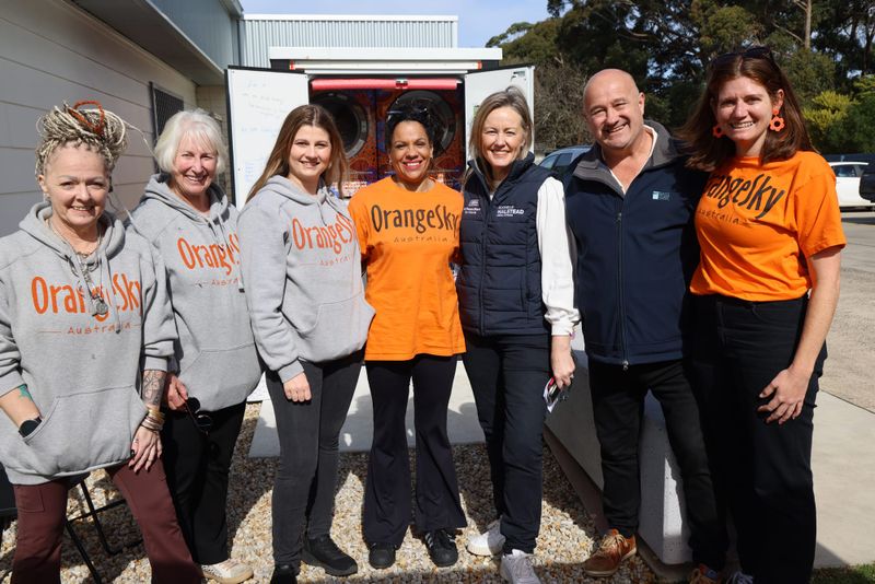 Community celebrates first year of Orange Sky laundry service post image