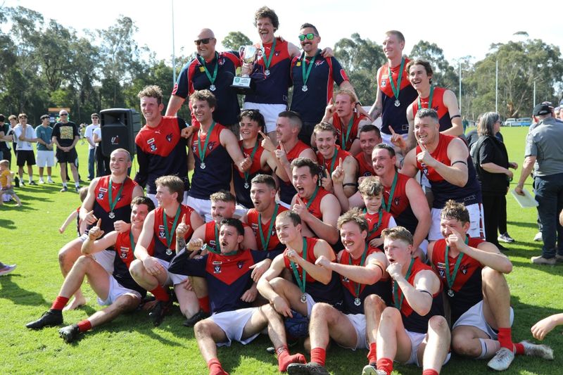 The MDU reserves premiership side celebrate with the cup