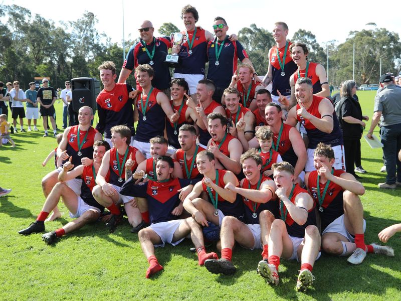 The MDU reserves premiership side celebrate with the cup
