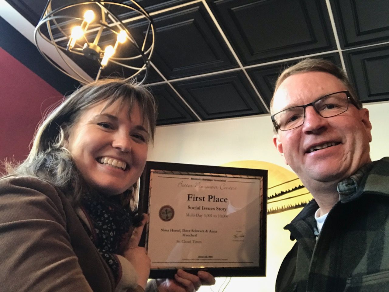 Nora-Hertel-and-Dave-Schwarz-smile-while-holding-a-First-Place-award-from-MNA-Feb.-1,-2023.-(Courtesy-of-Dave-Schwarz)
