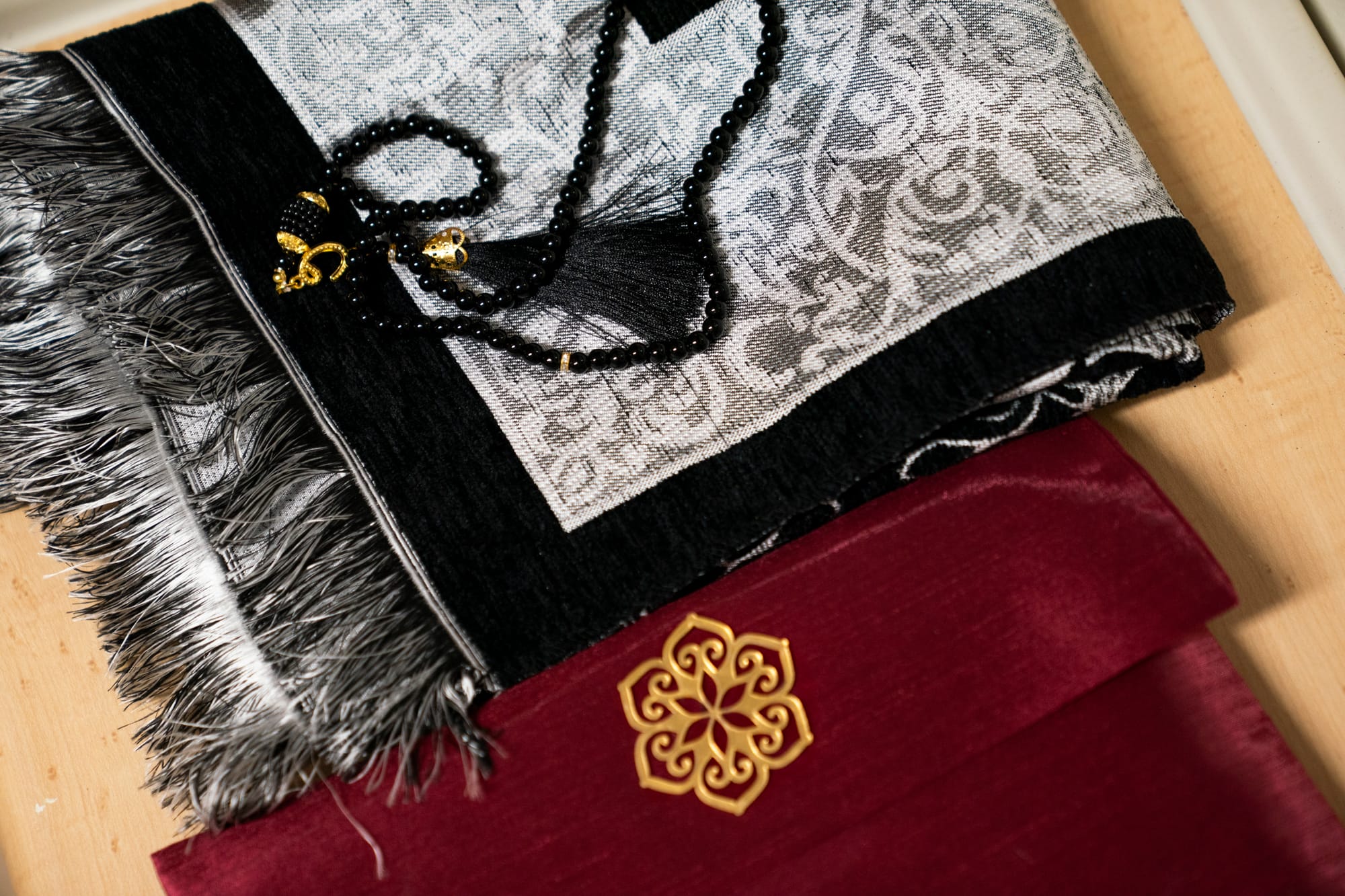 Prayer beads are seen on a table during a training exercise about end-of-life scenarios for nursing students. 