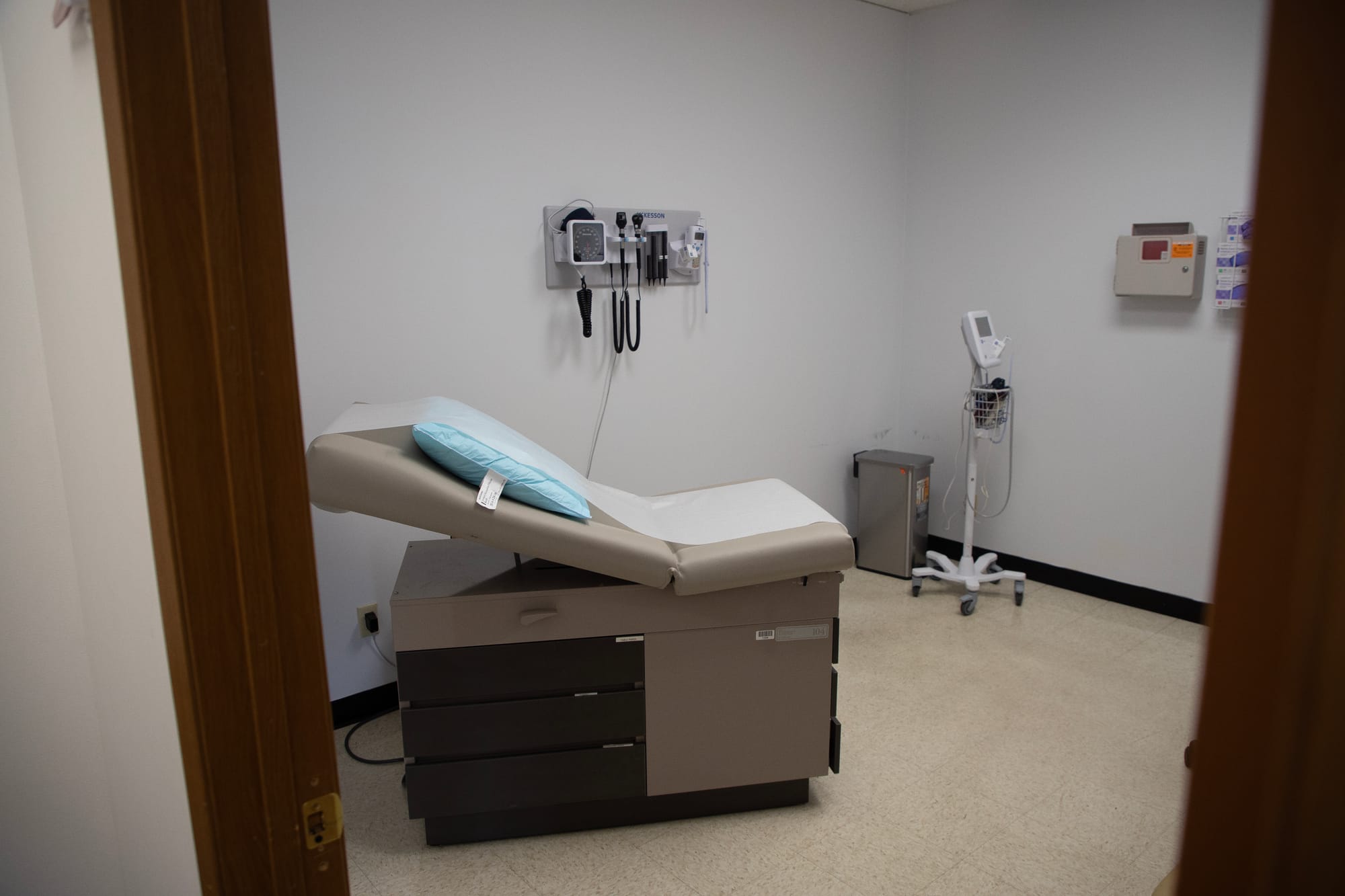 A medical exam room is pictured. 