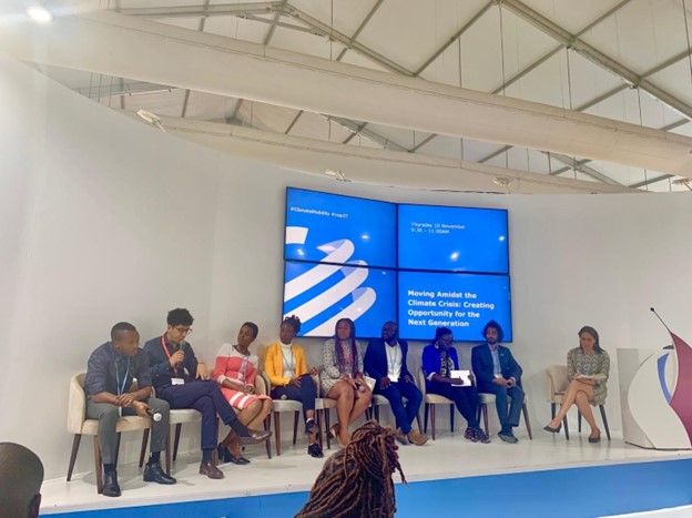 Panelists at COP27 in Sharm el Sheikh, Egypt, speak about “Moving Amidst the Climate Crisis: Creating Opportunity for the Next Generation,” at the Global Centre for Climate Mobility on November 10, 2022. (Courtesy of Fredi Ponce Parra)