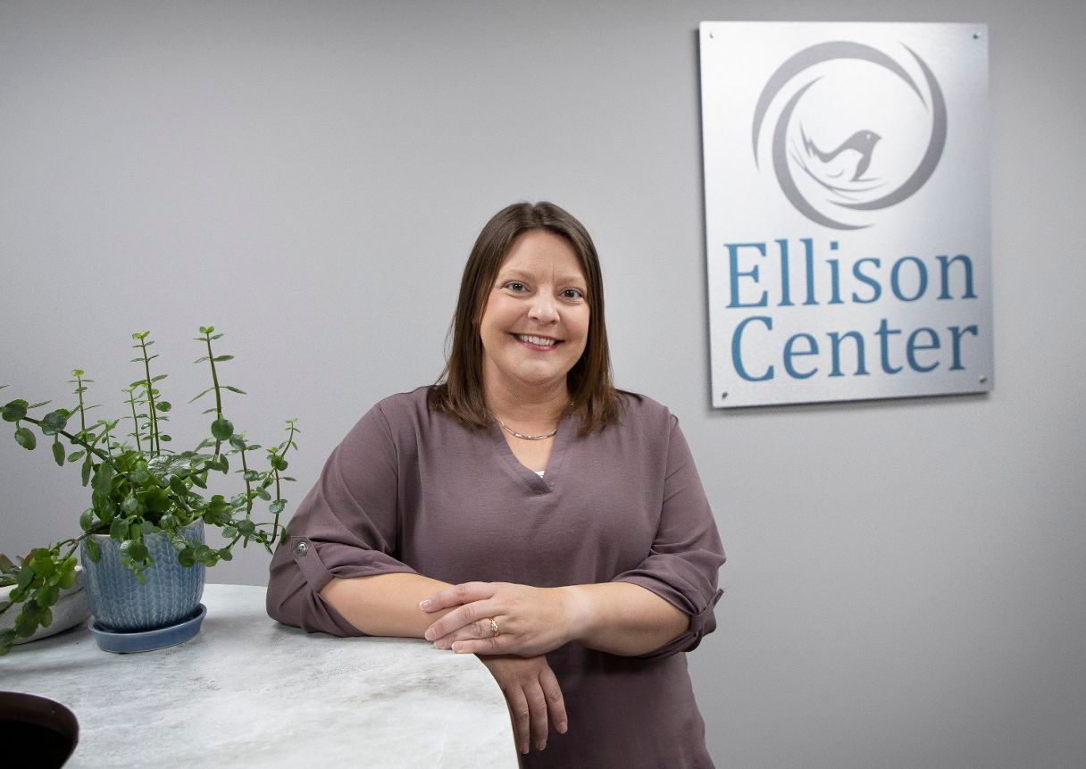 Tracy-Schreifels-poses-for-a-photo-at-the-Ellison-Center-in-St.-Cloud.-(Colleen-Harrison-for-The-Optimist)