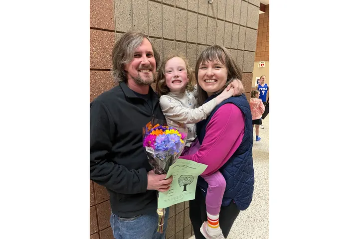 A family poses for a portrait. 