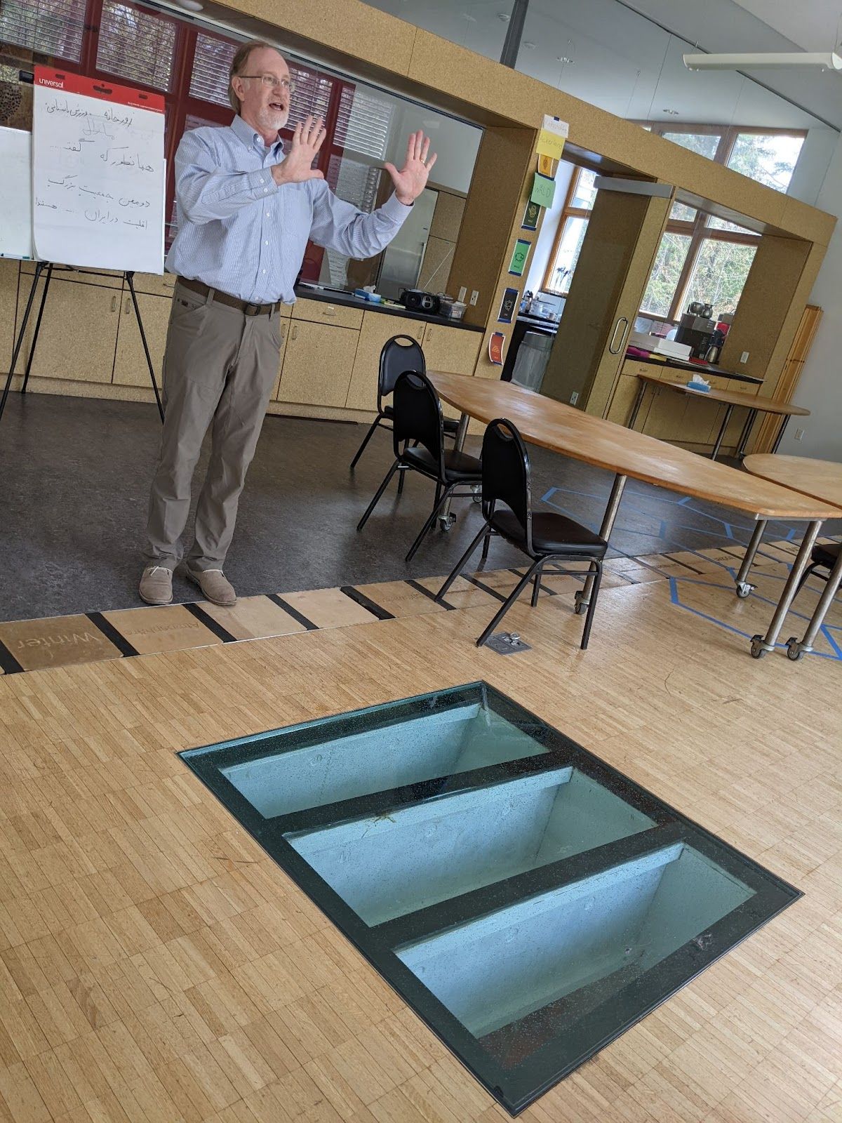 Natural lights reaches the lower level of the BioHaus through a skylight in the floor, explains Concordia Language Villages-Bemidji's Director of Operations Warren Schulze. The south-facing windows let in light and warmth. (Nora Hertel for Project Optimist)