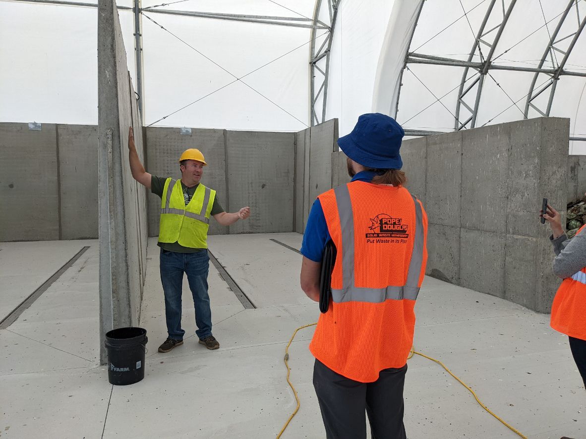 Environmental Coordinator Nathan Reinbold talks about the technology and set up at the new Glacial Ridge Compost Facility in Hoffman, Minn., during a tour on Tuesday, Aug. 16, 2022. (Nora Hertel for Project Optimist)