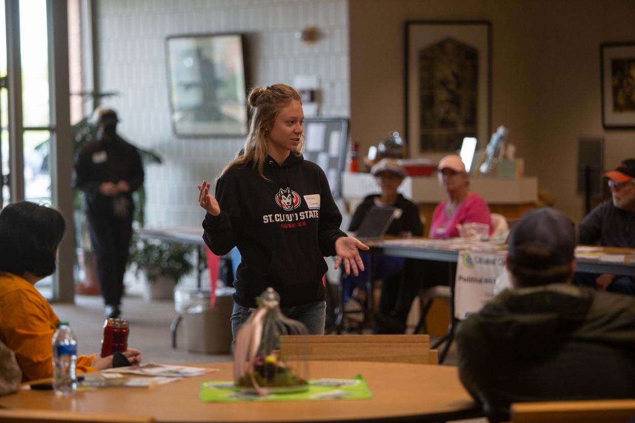 The project drew support from the city of St. Cloud, the Stearns County Soil and Water Conservation District and the Sauk River Watershed District. Photo: Allison Schwab, environmental compliance assistant with the city, speaks to the volunteers at Bethlehem Lutheran Church.