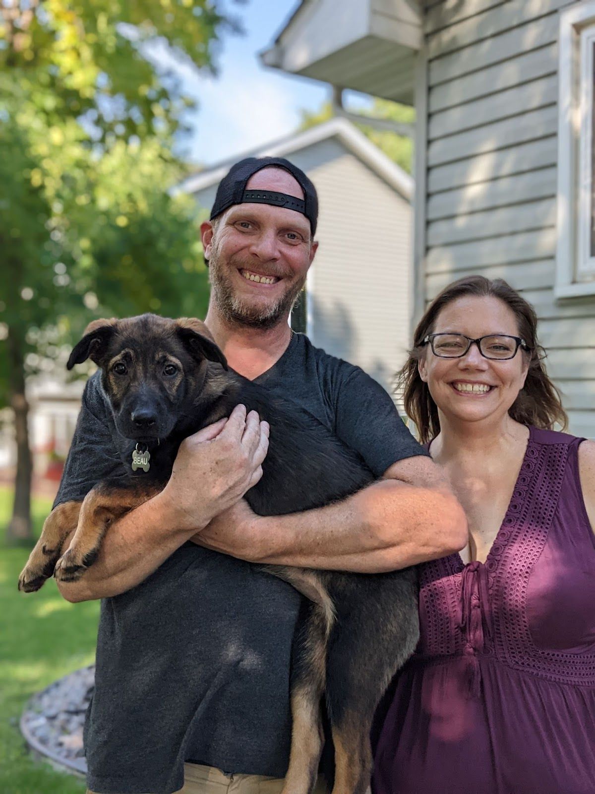 Aaron and Janelle Bradley pose with their puppy Beau on Friday, Sept. 2, 2022, at their Albertville, Minn., home, where they raise their two children. (Courtesy of Jen Moeller)