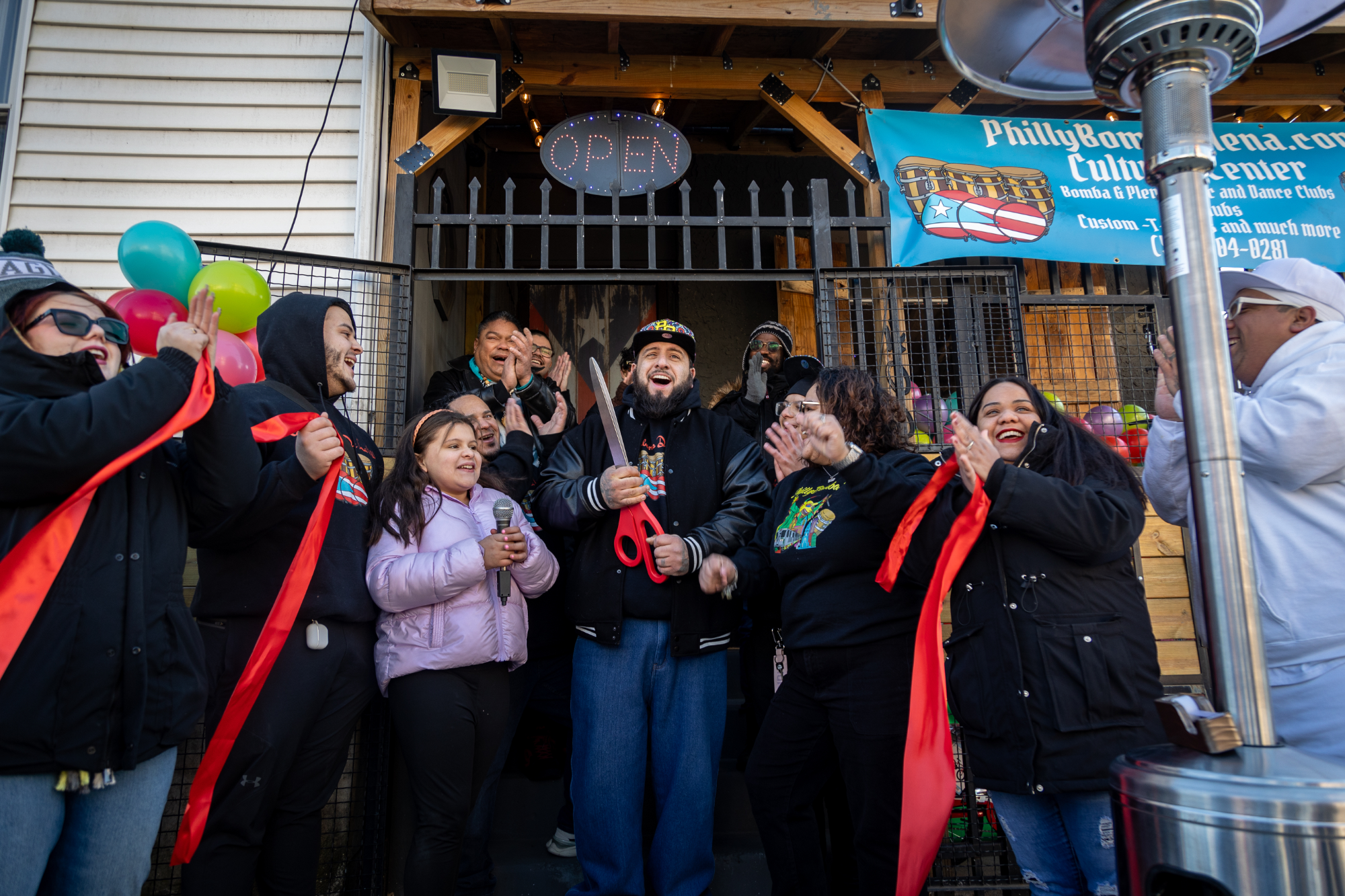 Family and musicians celebrate ribbon cutting at Los Bomberos de la Calle grand opening