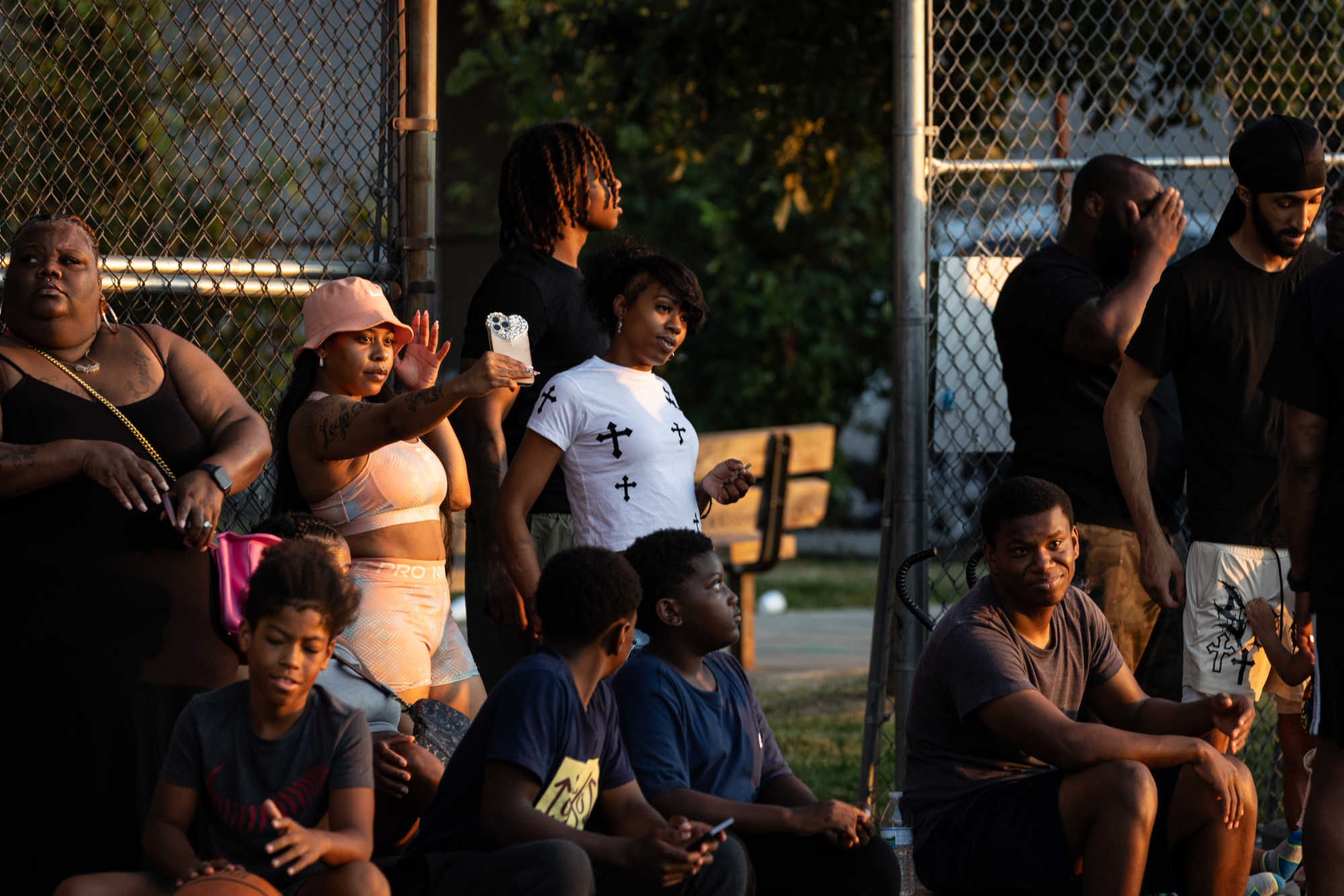 Community members gather to watch and take selfies