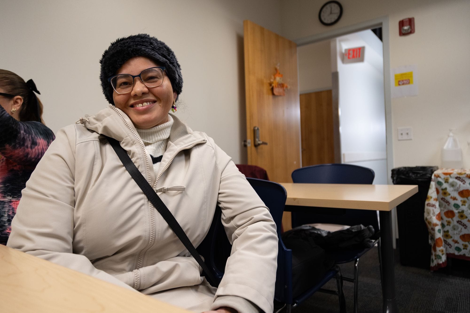 Student takes notes during GED class at Congreso