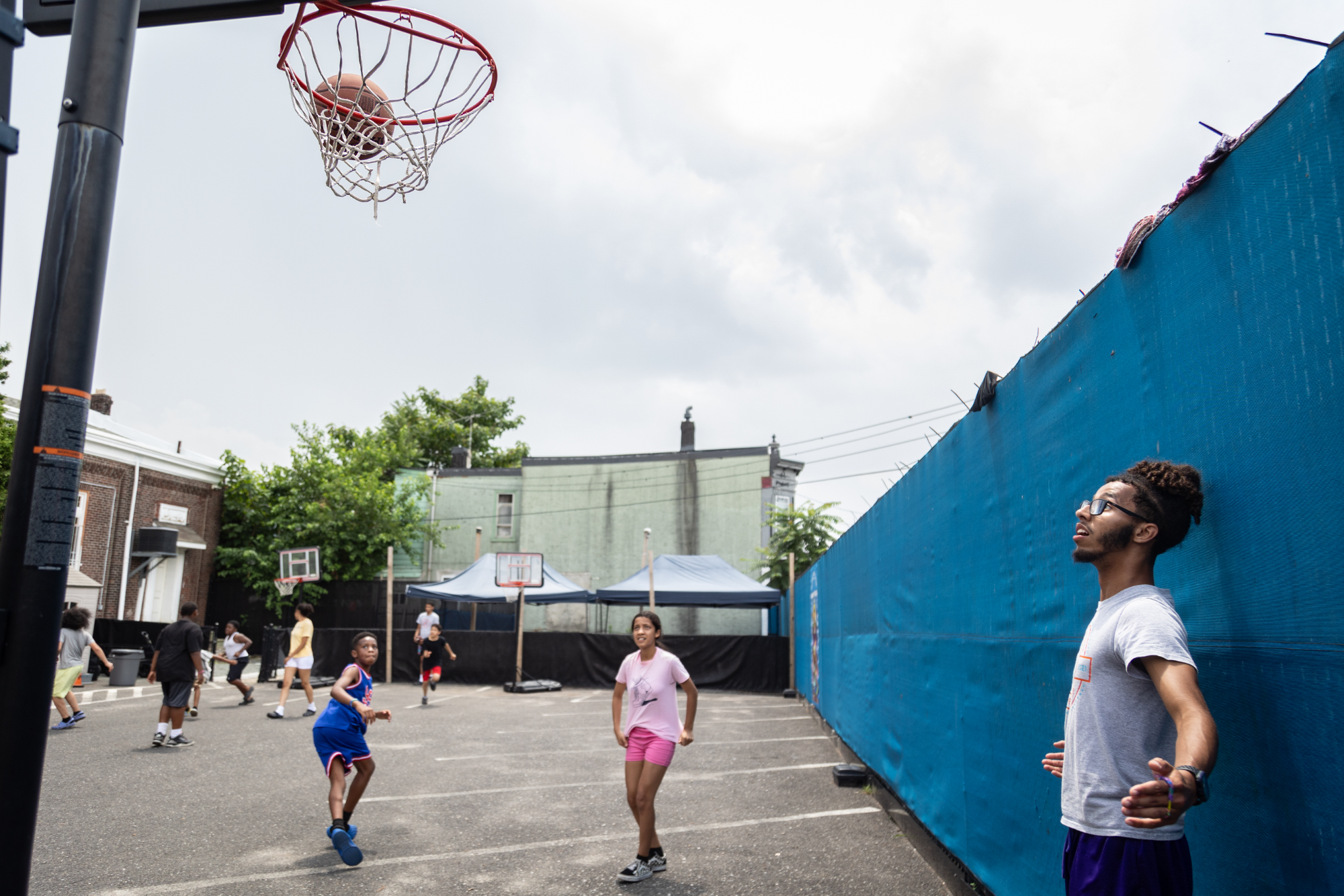Kids play basketball at Mother of Mercy House summer camp